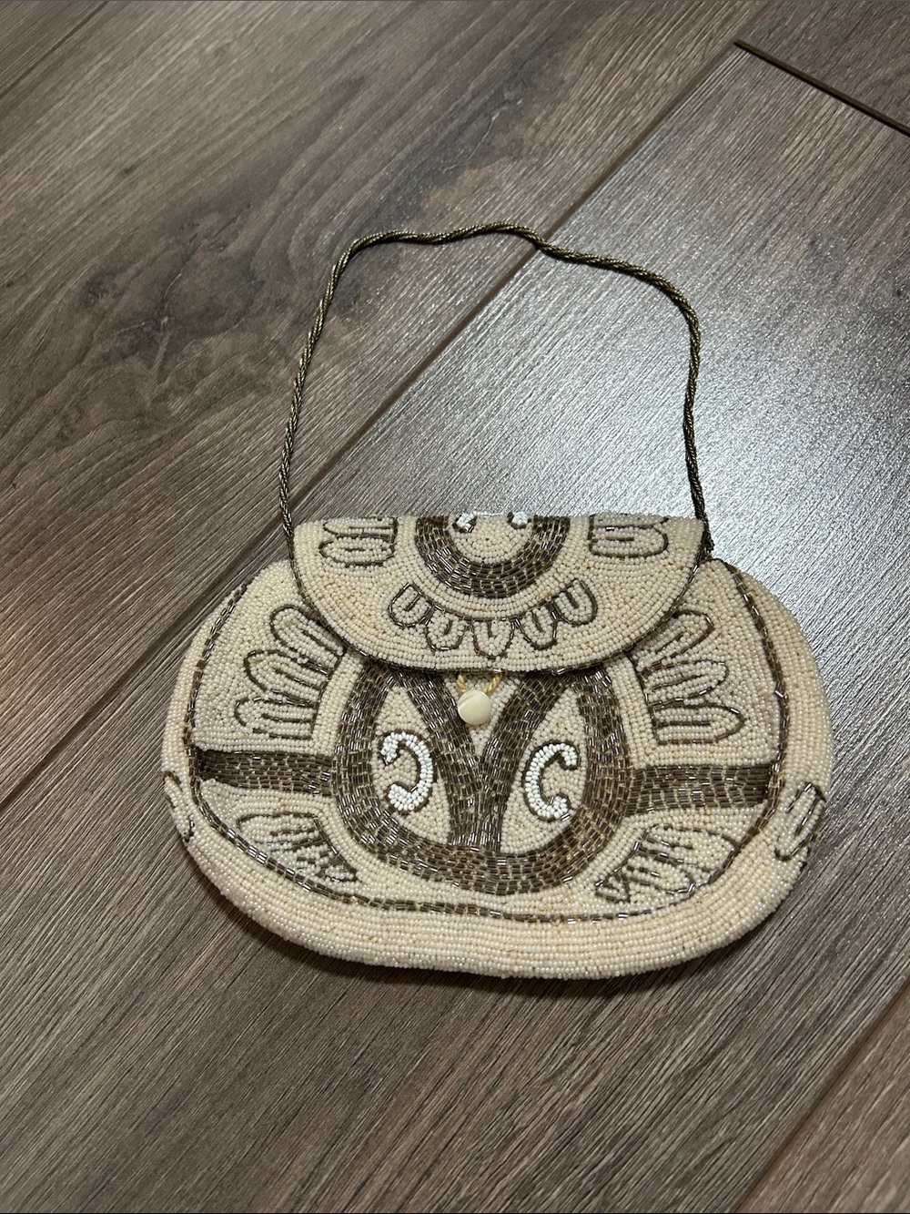 An Elegant Timeless Vintage Beaded clutch with delicate antique style beads.